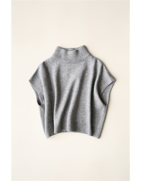 Wearing a low necked small stature with a high necked knitted pullover